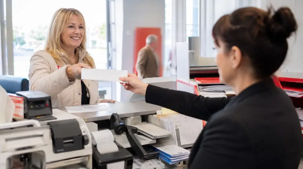 Can Cheques Be Paid Into a Bank Account at the Post Office